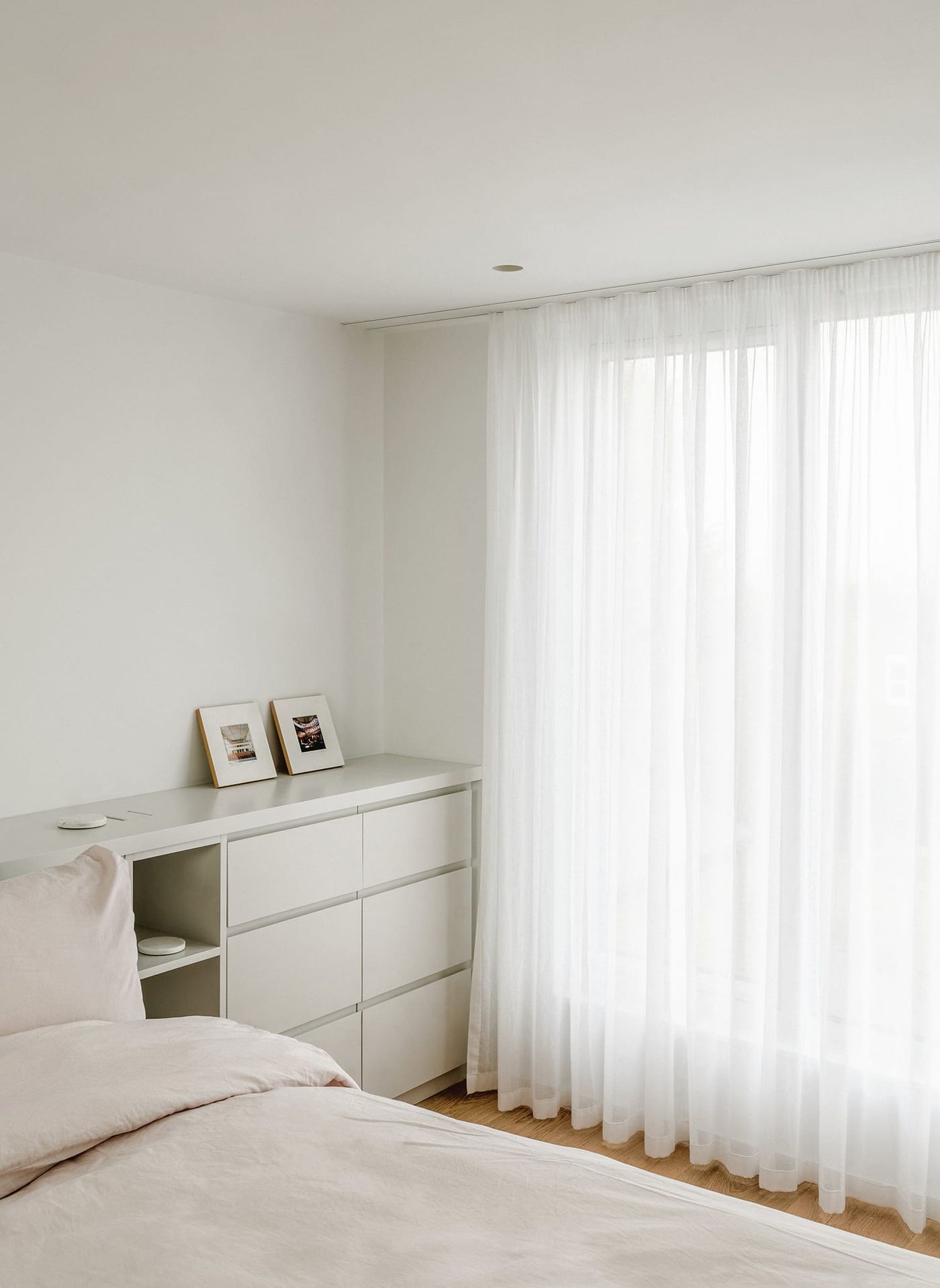 Internal view looking into light, calm rear dormer extension in South London designed by From Works.