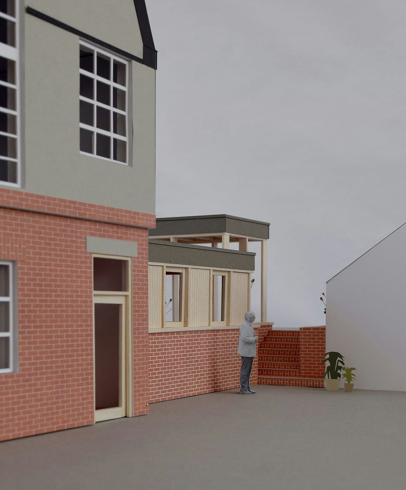 External model photograph for From Work's stepped brick and timber rear extension.
