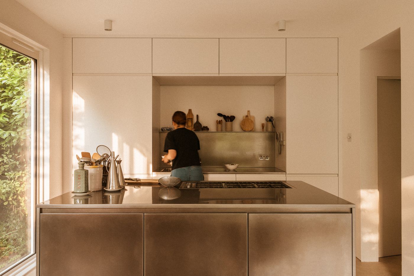 White painted and stainless steel Ma-kon kitchen.