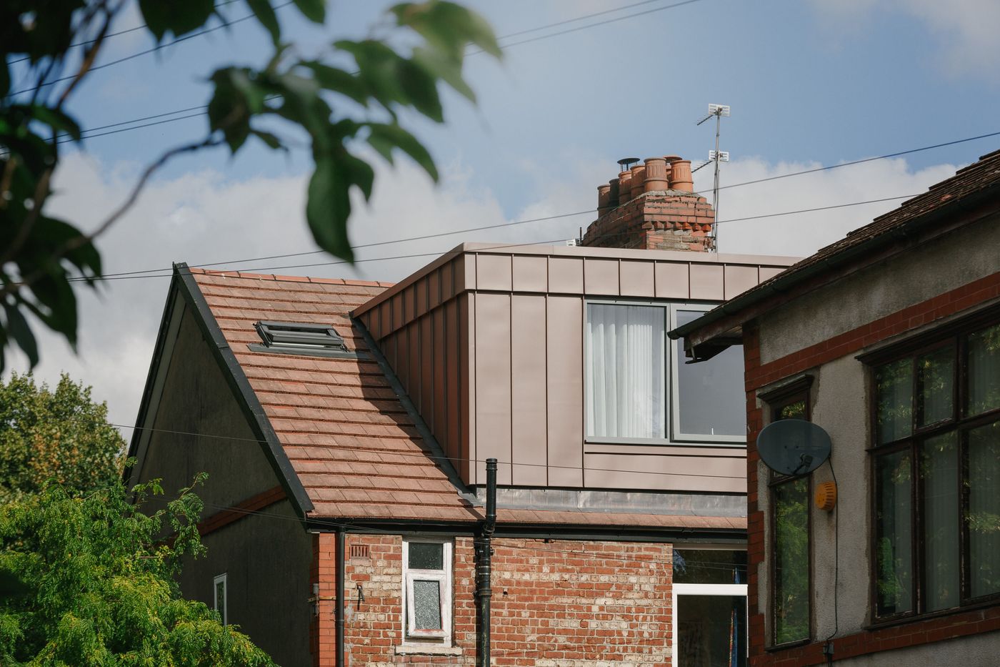 Whalley Range Red Zinc Dormer Extension in Manchester designed by From Works.