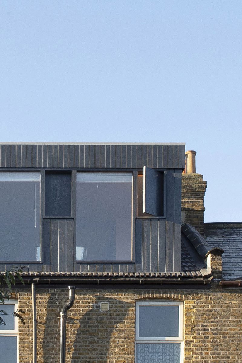 External view of From Works' vertical timber clad rear dormer extension in East London.
